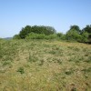 Cumbre sobre una colina redondeada ubicada al sudoeste de la estructura orográfica